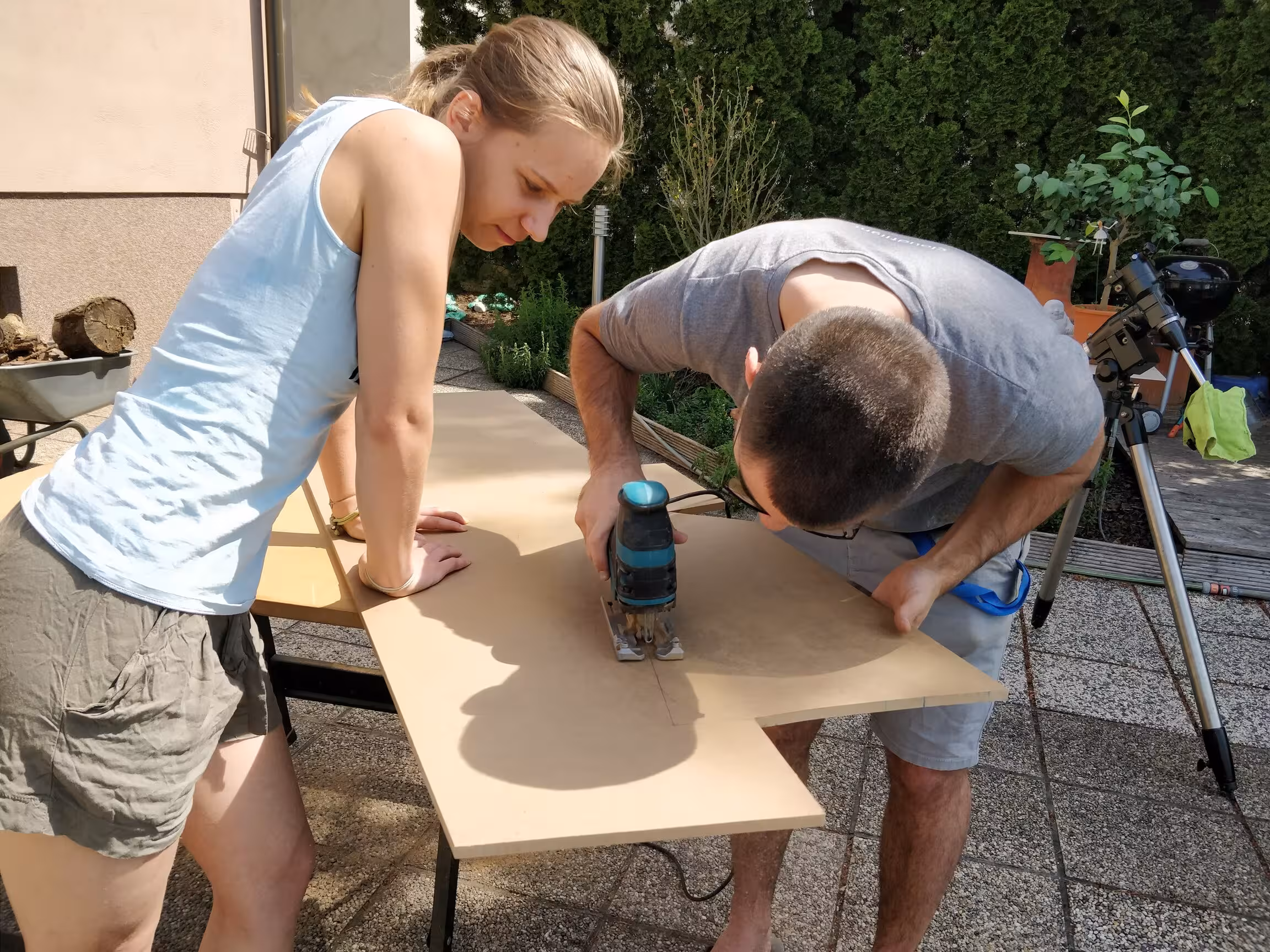 my husband and myself, cutting wooden panels